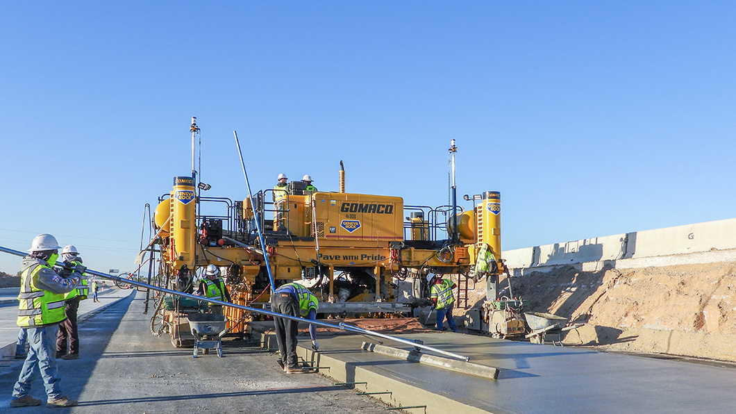 Construction crew using concrete paver with Trimble Paving Control solutions on road project