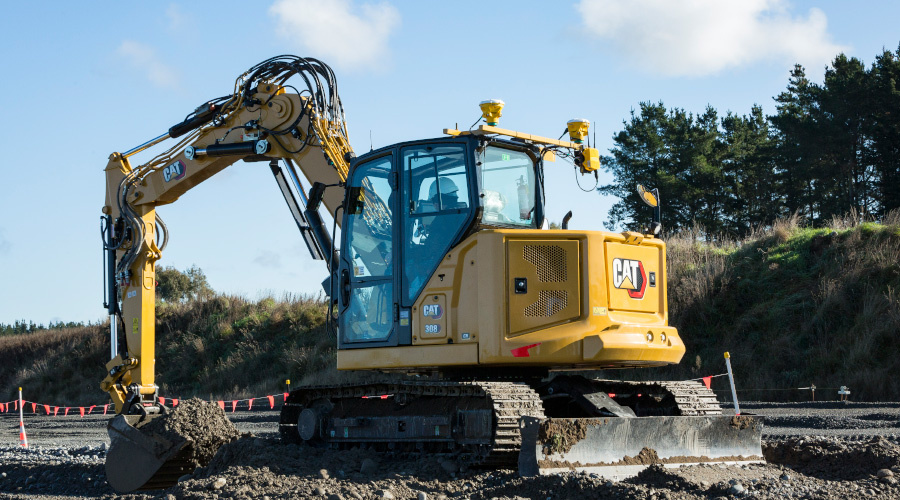 CAT compact excavator with Trimble Earthworks on construction site.